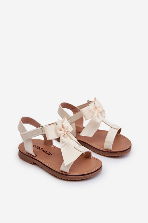 Lakotas sandales Bērnu apavi ar bantītēm ar lipīgām aizdarēm Ziloņkaula krāsas Joratia Lakotas sandales Bērnu apavi ar bantītēm ar lipīgām aizdarēm Ziloņkaula krāsas Joratia