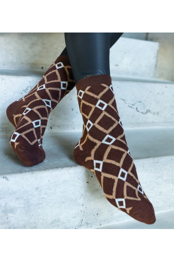 Melnbaltas siltās zeķes Sella