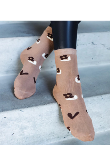 Melnbaltas siltās zeķes Sella