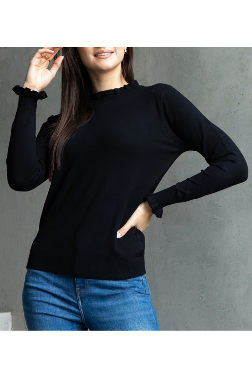 Melns mīksts džemperis, dekorēts ar... Melns mīksts džemperis, dekorēts ar...