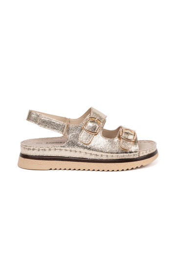 Zelta krāsas kurpes ze mi elementami