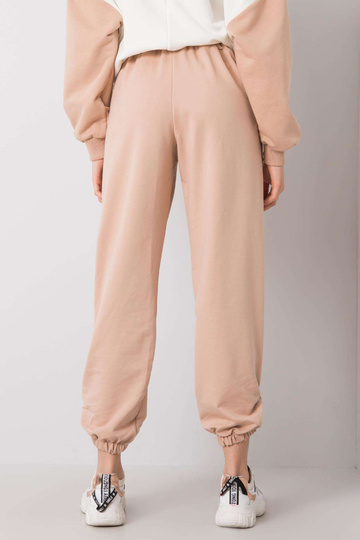 Bēšas treniņbikses Zelena