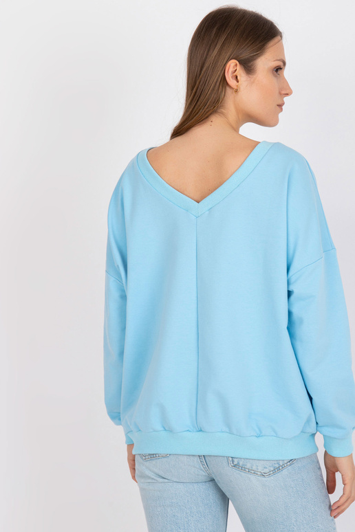 Gaiši zils un balts sporta krekls ar...