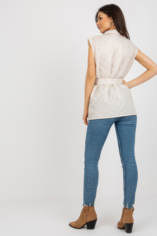 Gaiši bēša stepēta veste ar ielāpu un...