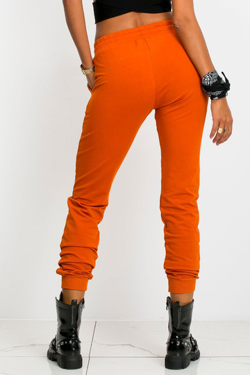 Tumši oranžas bikses Ātrāk 2