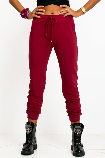 Tumši sarkanas bikses Ātrāk