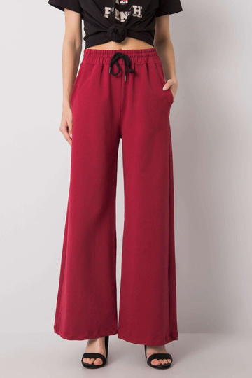 Burgundijas sporta bikses...