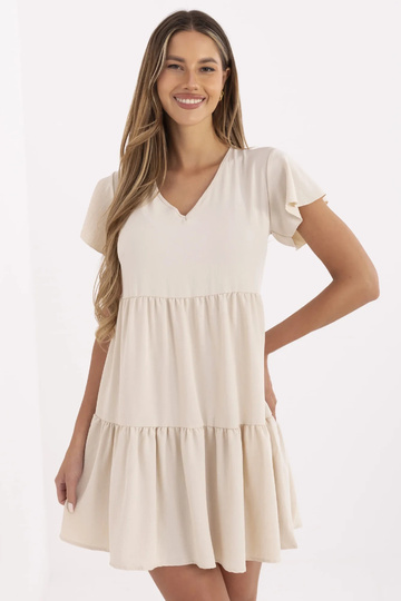 Bēša kleita ar volāniem...