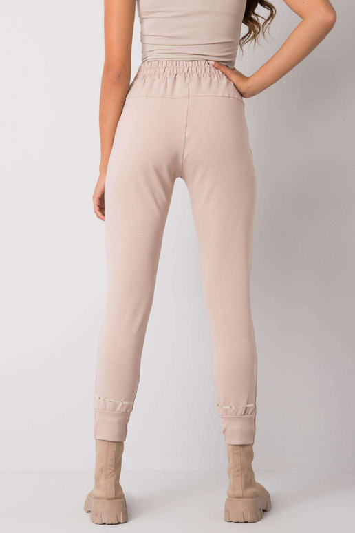 Bēšas sporta bikses ar apdruku Larissa