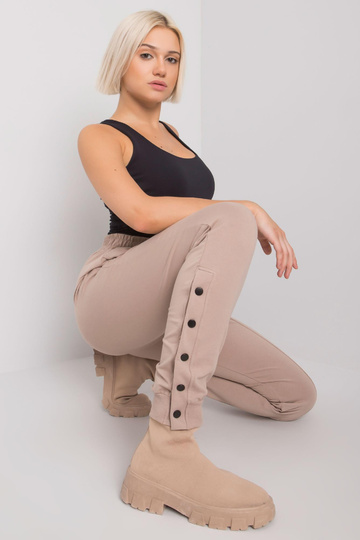 Tumši bēšas treniņbikses ar...