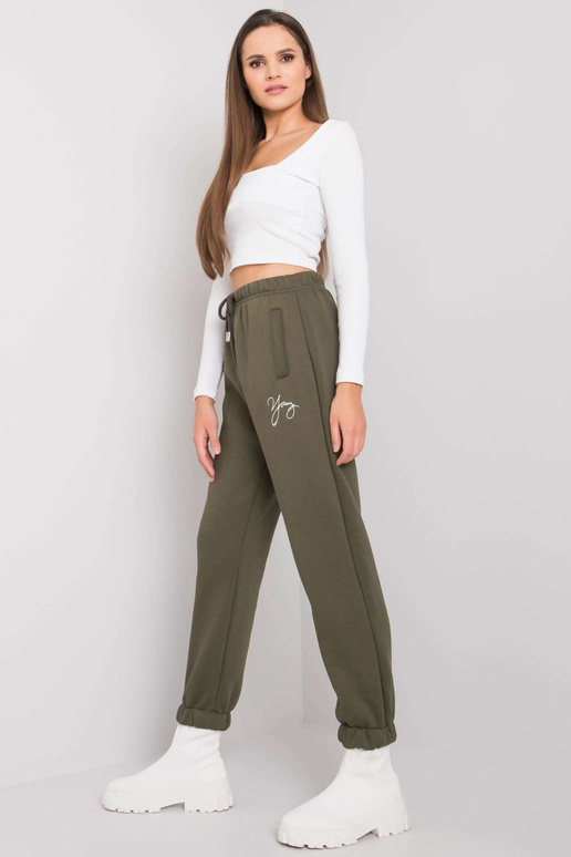 Caurspīdīgas haki krāsas treniņbikses...