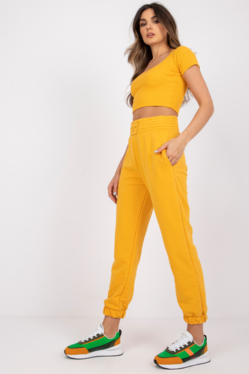 Gaiši oranžas sporta bikses... 2