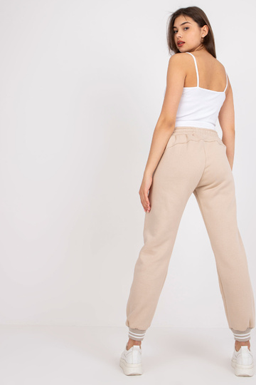 Bēšas sporta bikses...