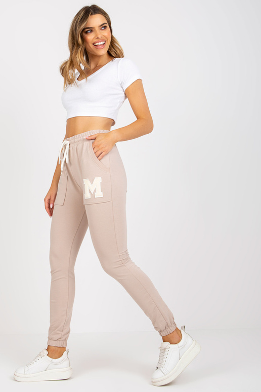 Bēšas kokvilnas treniņbikses ar kabatām