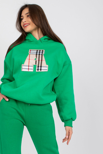 Zaļš džemperis ar plāksteri...