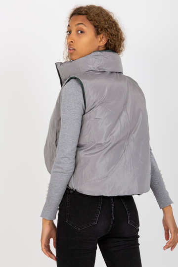 Tumši zaļa īsa dūnu veste...