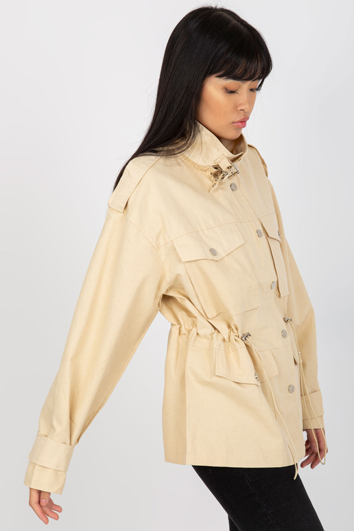 Gaiši bēša kokvilnas pārejas jaka ar... Gaiši bēša kokvilnas pārejas jaka ar...