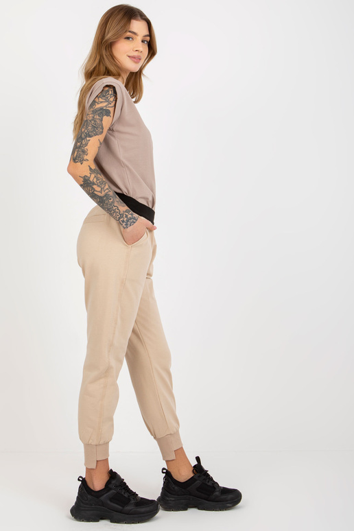 Bēšas pamata treniņbikses ar elastīgu...