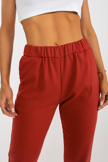 Tumši oranžas auduma bikses... 2