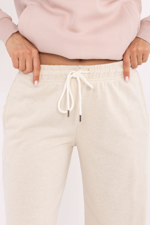 Gaiši smilškrāsas sporta bikses